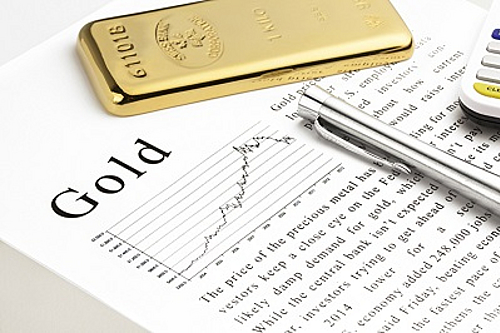 Goldbar on text and silver pen