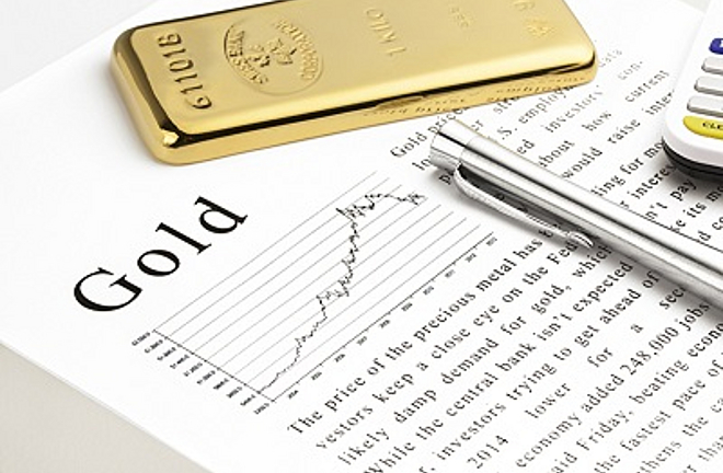 Goldbar on text and silver pen