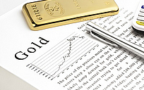 Goldbar on text and silver pen